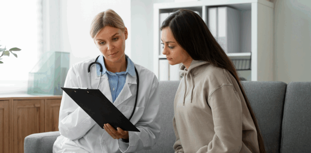 Patient and doctor smiling during NeuroStar Advanced TMS therapy session