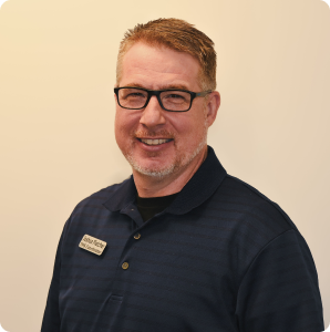 Professional headshot of Joshua Fletcher, TMS therapy specialist at TMS of the Carolinas