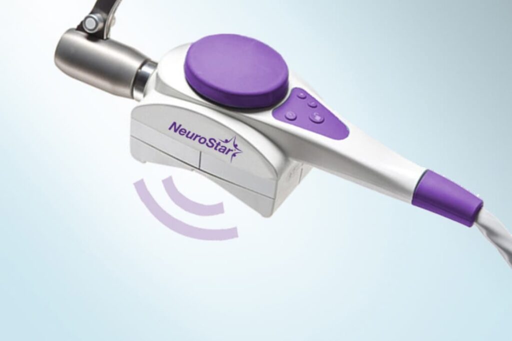NeuroStar TMS magnetic coil device emitting pulses, used in TMS therapy for depression vs medication treatment plans,